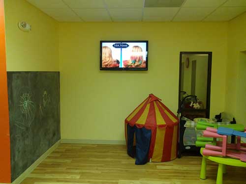 TV in daycare area for Inches Fitness